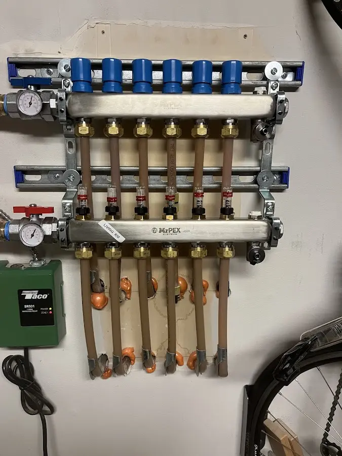 Plumber performing Water Heater Repair at a residential property in Merton